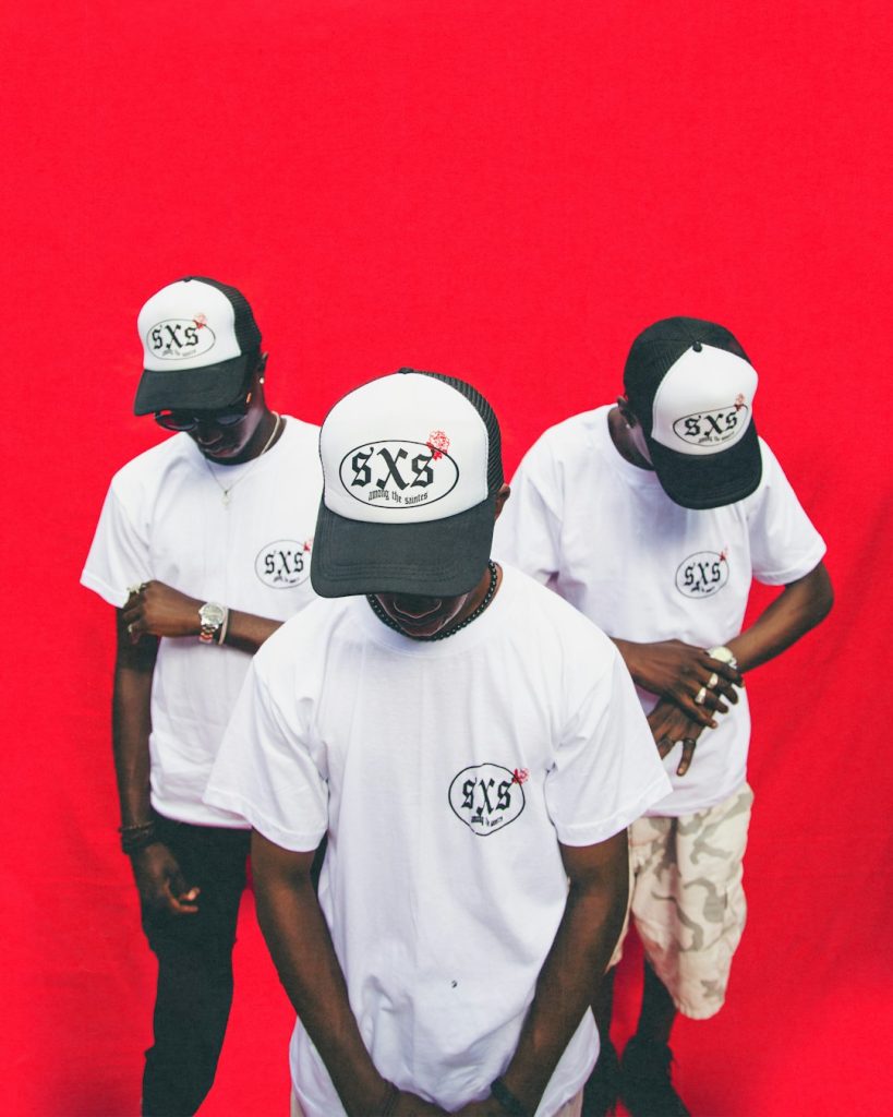 A Group Of Young Men Standing Next To Each Other Aj3s95kztto 819x1024